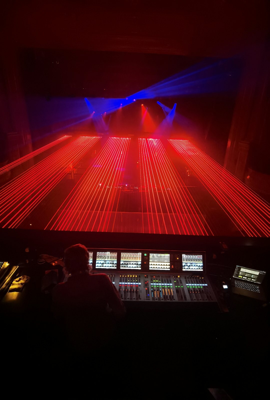 Live broadcast control room with multiple screens