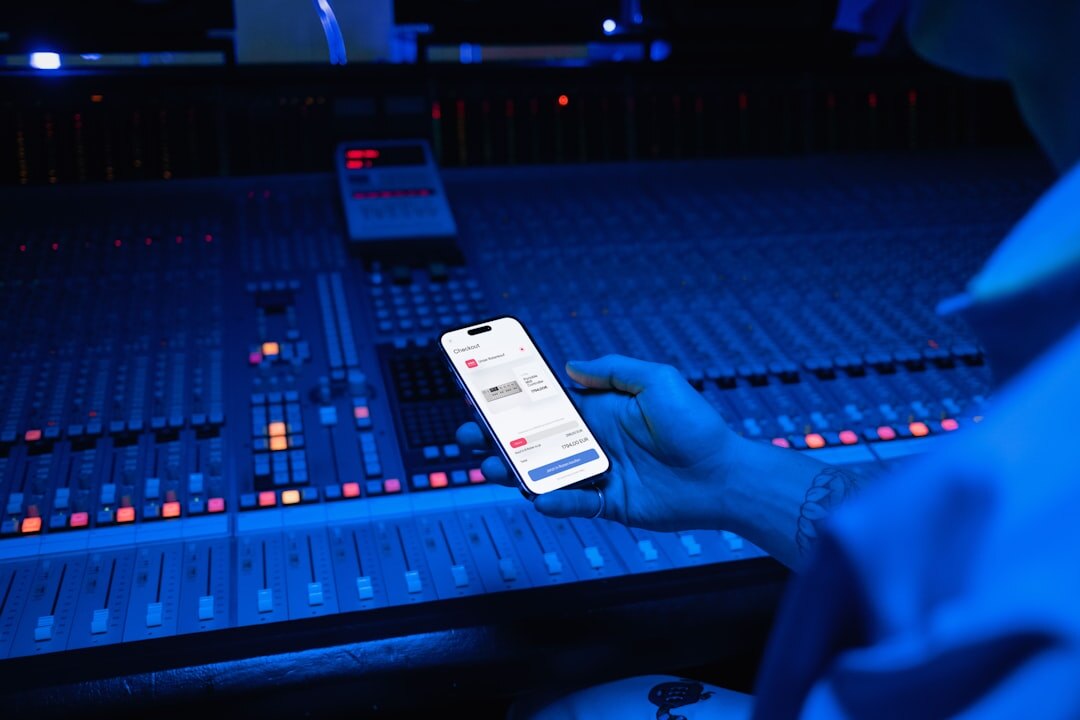 Sound engineer working at an audio mixing console