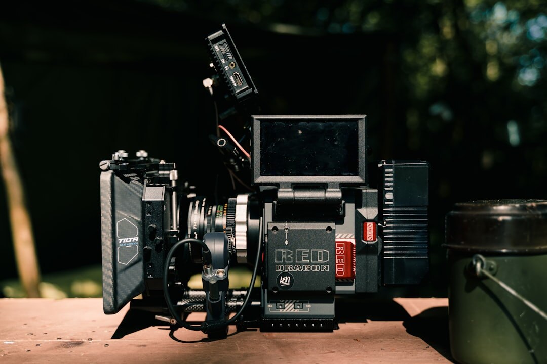 Vintage and modern broadcast camera equipment side by side